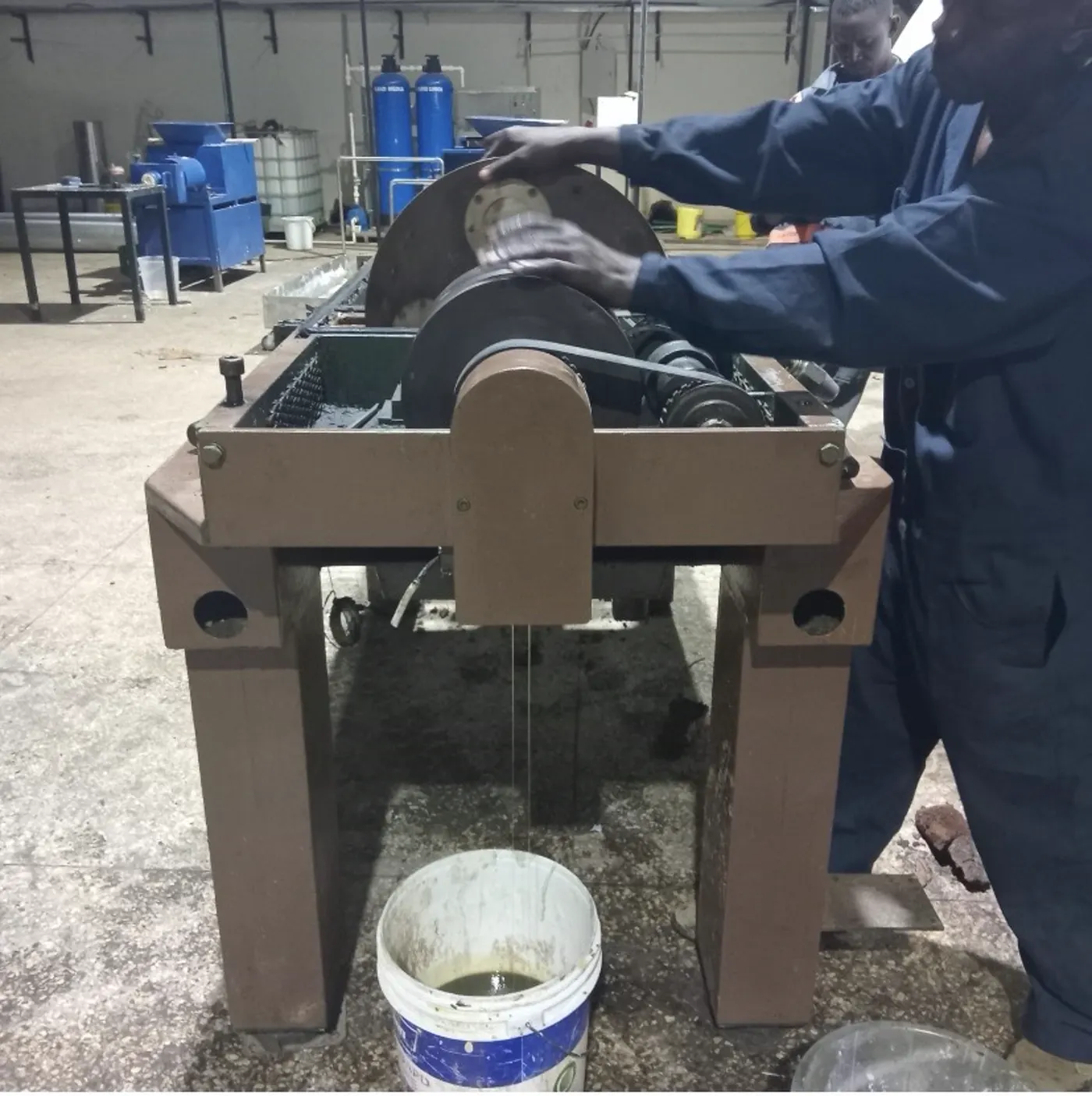 AMAT technician synchronising drive belts and gearbox on a processing machine