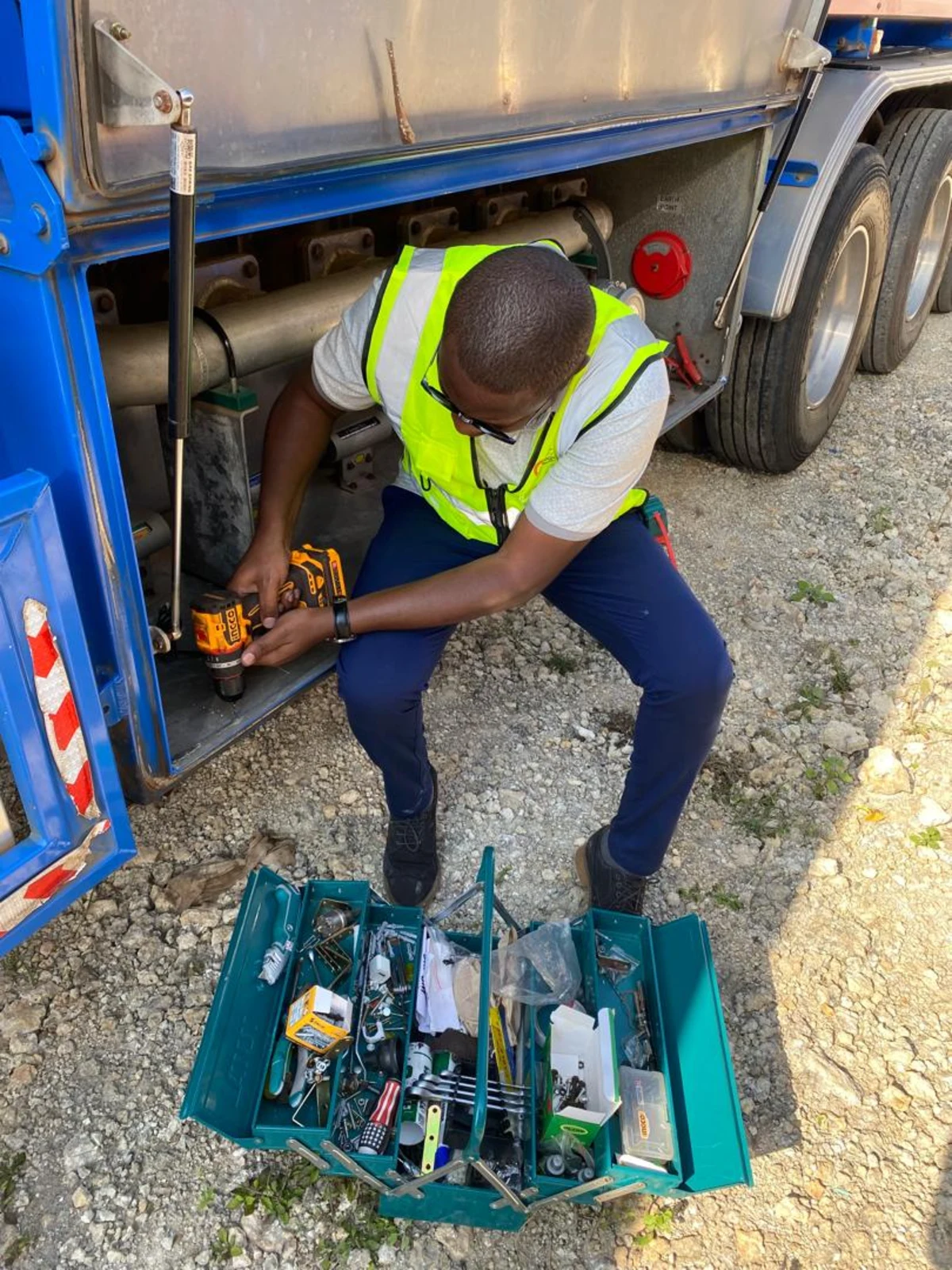 AMAT technician installing an offloading compartment sensor